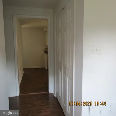 a bathroom with a shower curtain and a sink