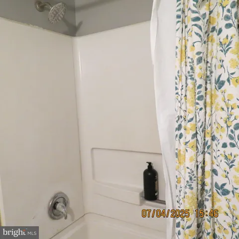 a view of an empty room and wooden floor