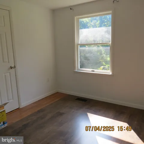 a bedroom with a bed and gym equipment