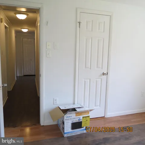 a view of livingroom with window and hardwood floor