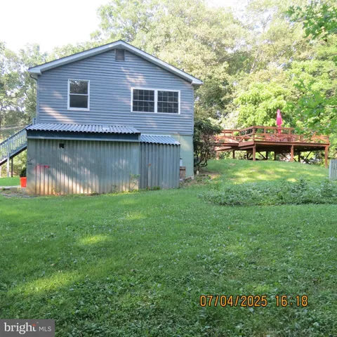 a backyard of a house with lots of green space