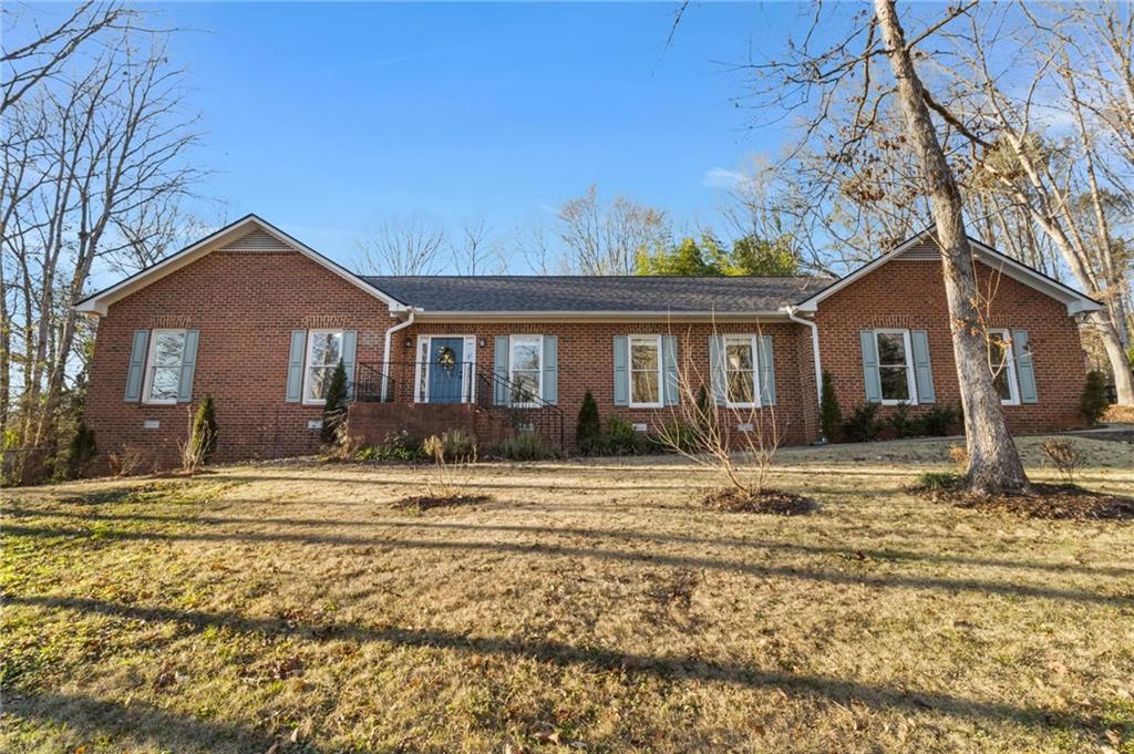 1031 Barnett Place Athens, GA 30605 - Photo 1 of 1 a front view of a house with a garden