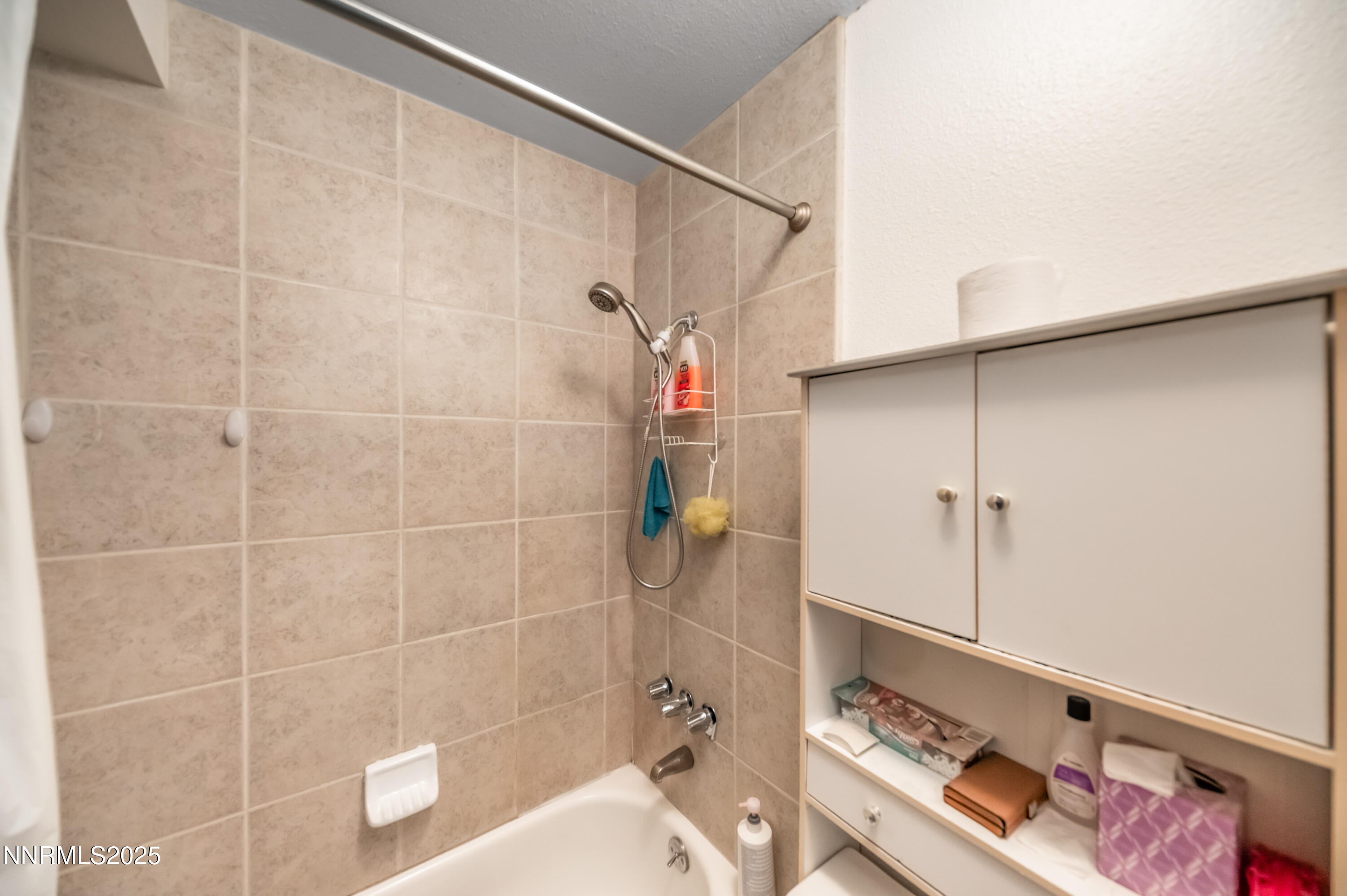 2700 Plumas Street, Unit 211 Reno, NV 89509 - Photo 6 of 11 a bathroom with a tub and a shower