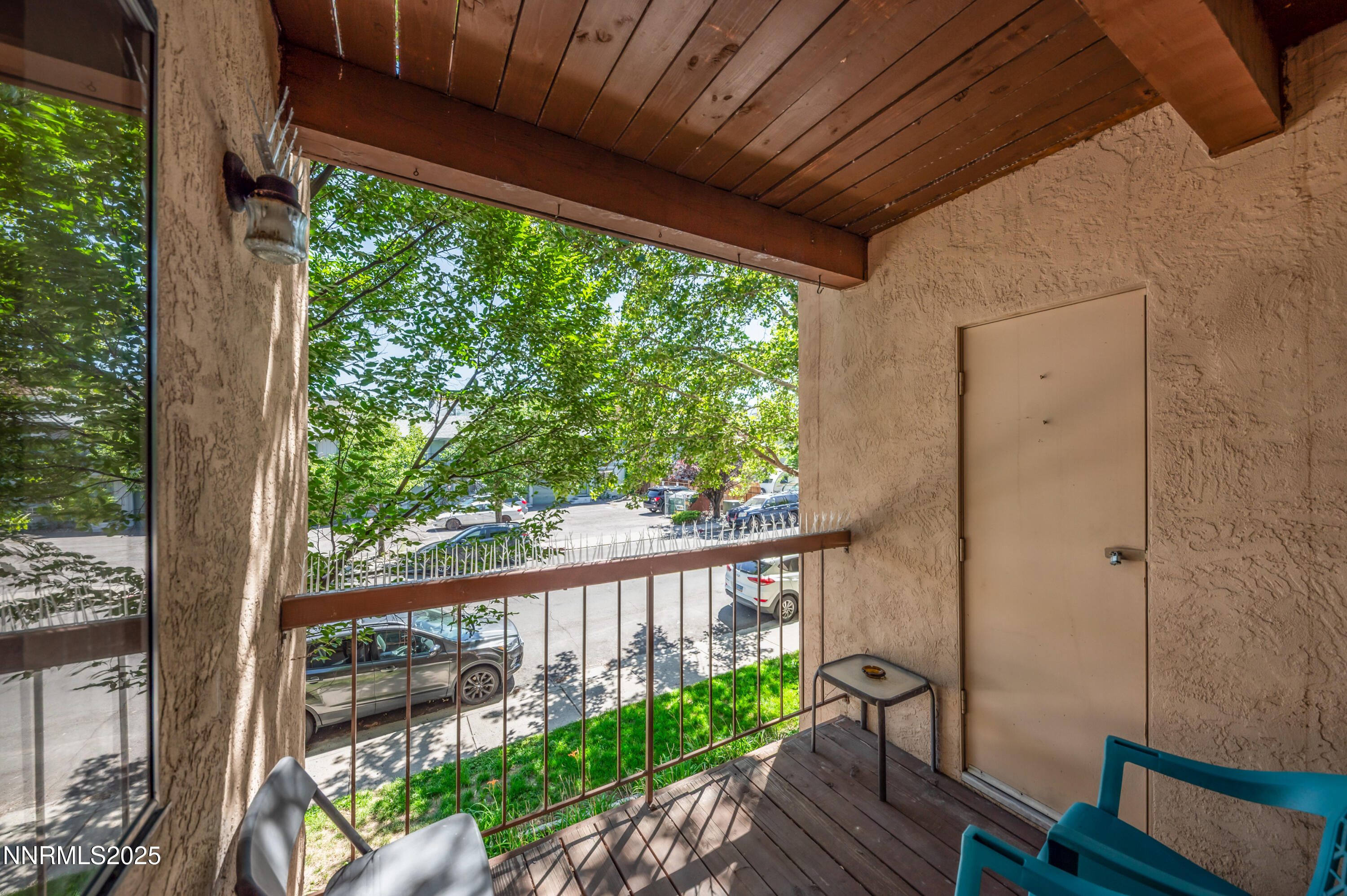 2700 Plumas Street, Unit 211 Reno, NV 89509 - Photo 7 of 11 a view of a balcony with wooden floor