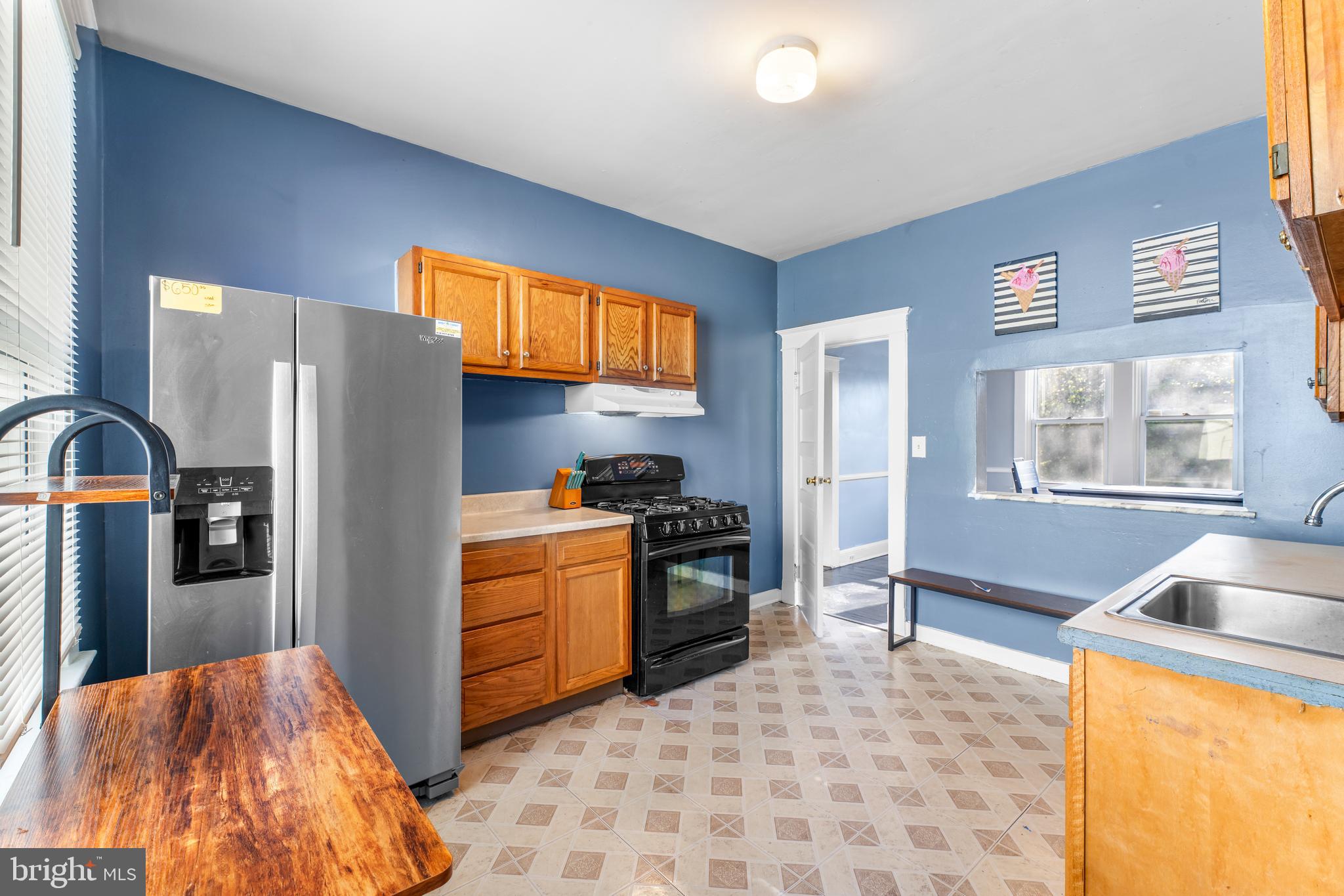 608 Tunbridge Road Baltimore, MD 21212 - Photo 13 of 27 a kitchen with stainless steel appliances granite countertop a refrigerator and a sink