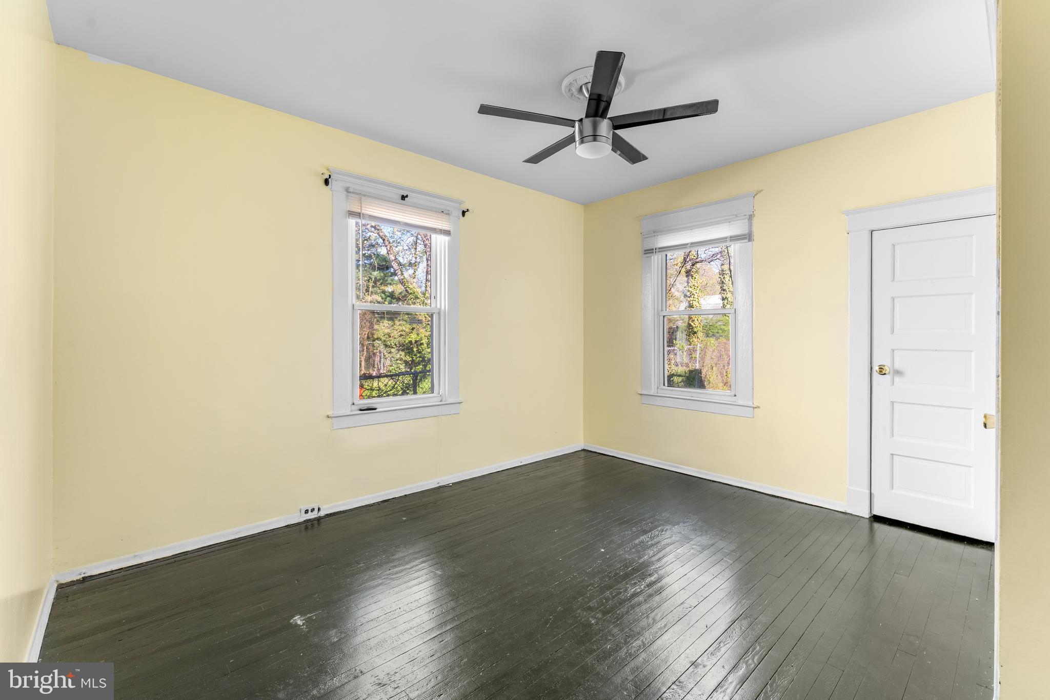608 Tunbridge Road Baltimore, MD 21212 - Photo 14 of 27 a view of a big room with wooden floor and windows