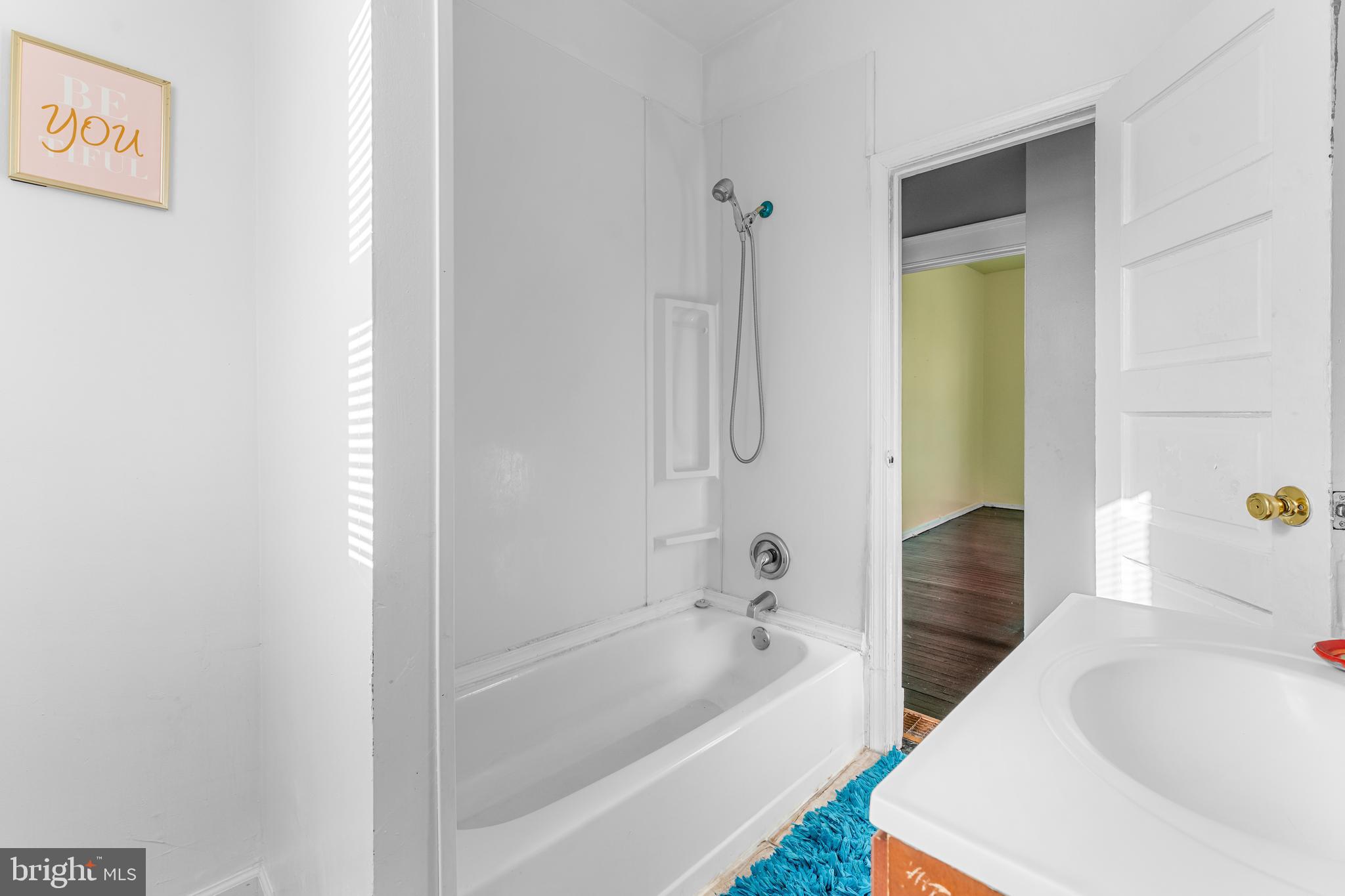 608 Tunbridge Road Baltimore, MD 21212 - Photo 17 of 27 a bathroom with a tub sink and mirror