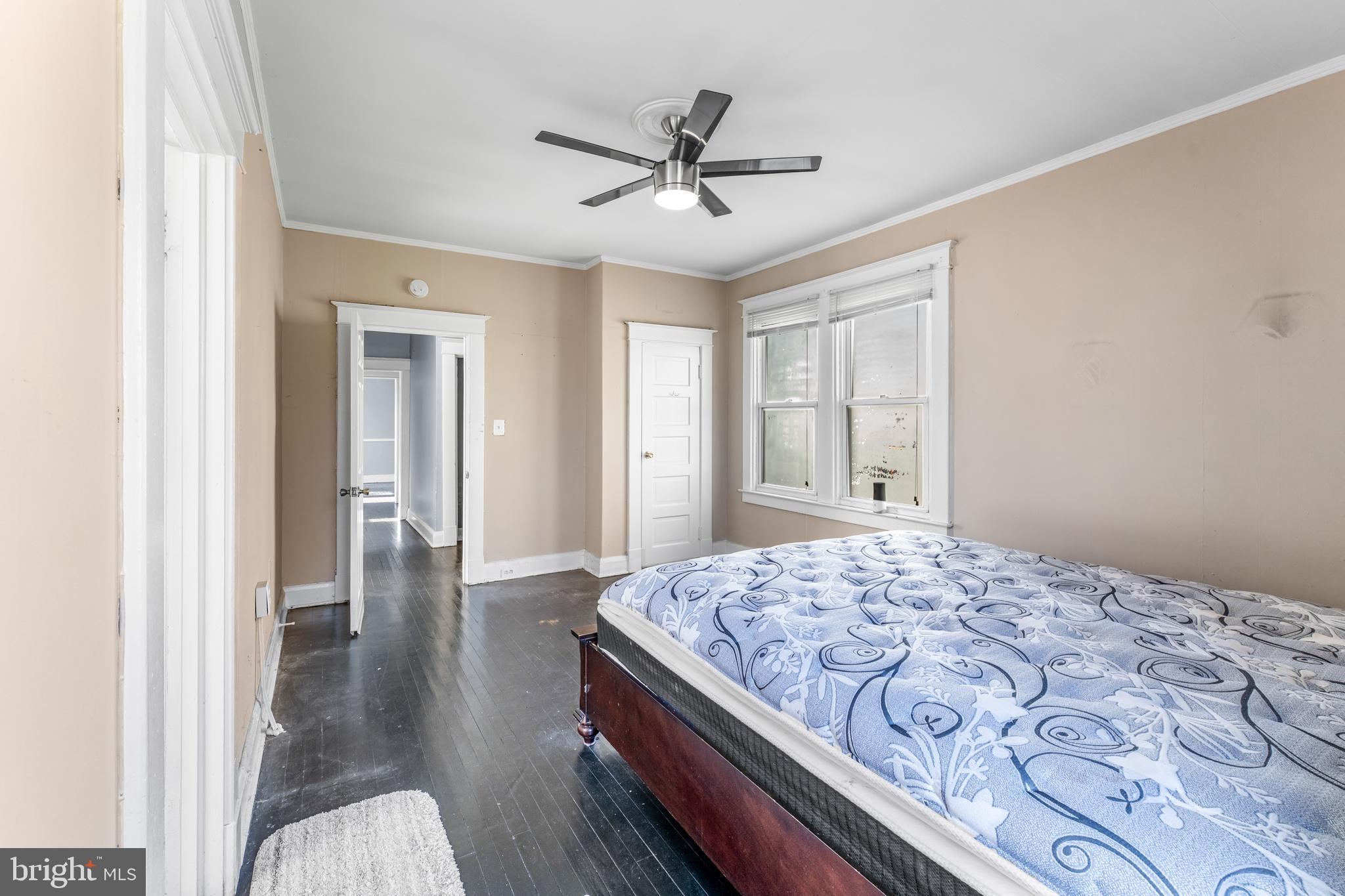 608 Tunbridge Road Baltimore, MD 21212 - Photo 19 of 27 a bedroom with a bed and a chandelier