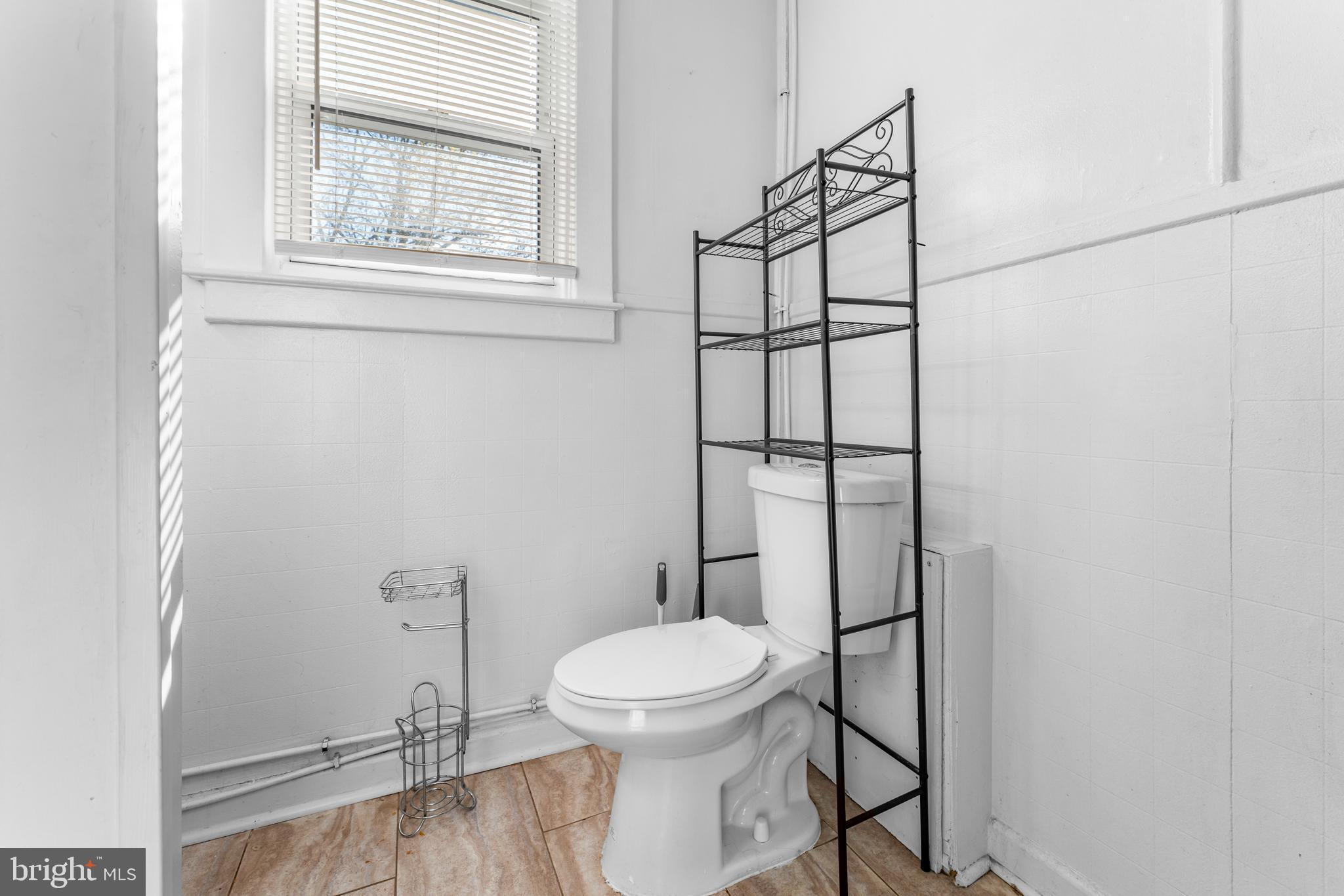 608 Tunbridge Road Baltimore, MD 21212 - Photo 22 of 27 a bathroom with a toilet and a shower