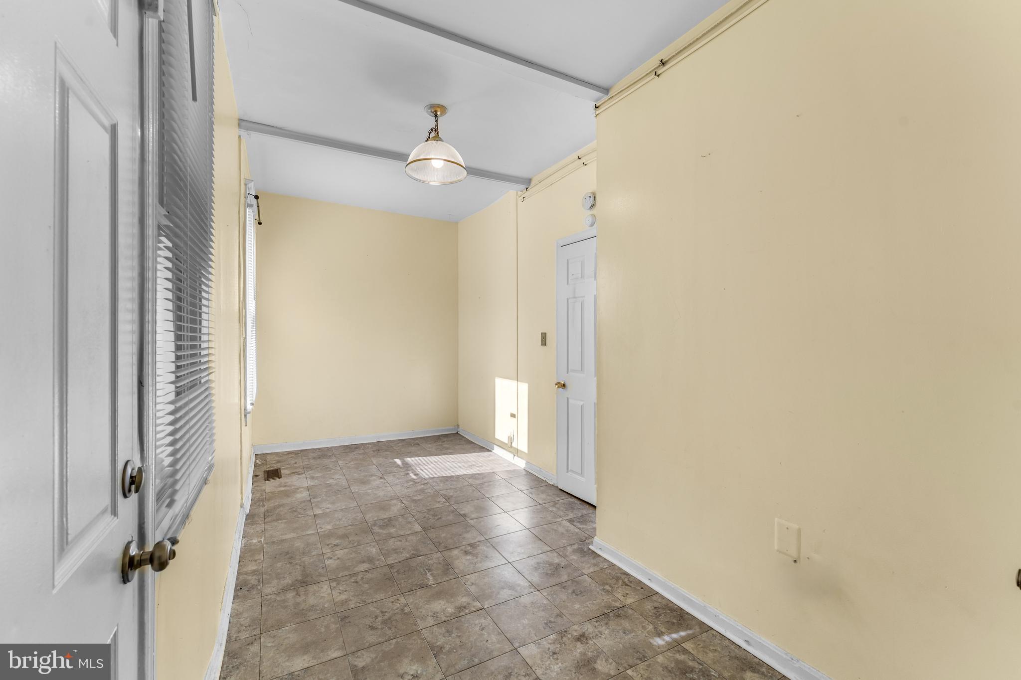 608 Tunbridge Road Baltimore, MD 21212 - Photo 23 of 27 a view of a hallway with a wooden door