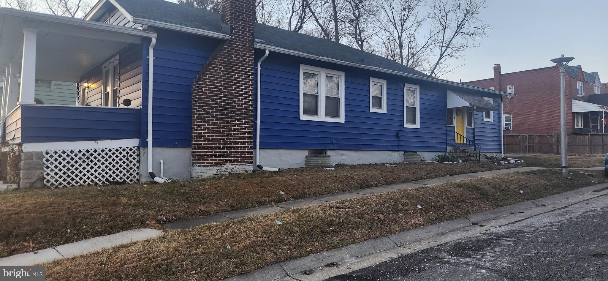 608 Tunbridge Road Baltimore, MD 21212 - Photo 5 of 8 Sideview of home showing brick chimney