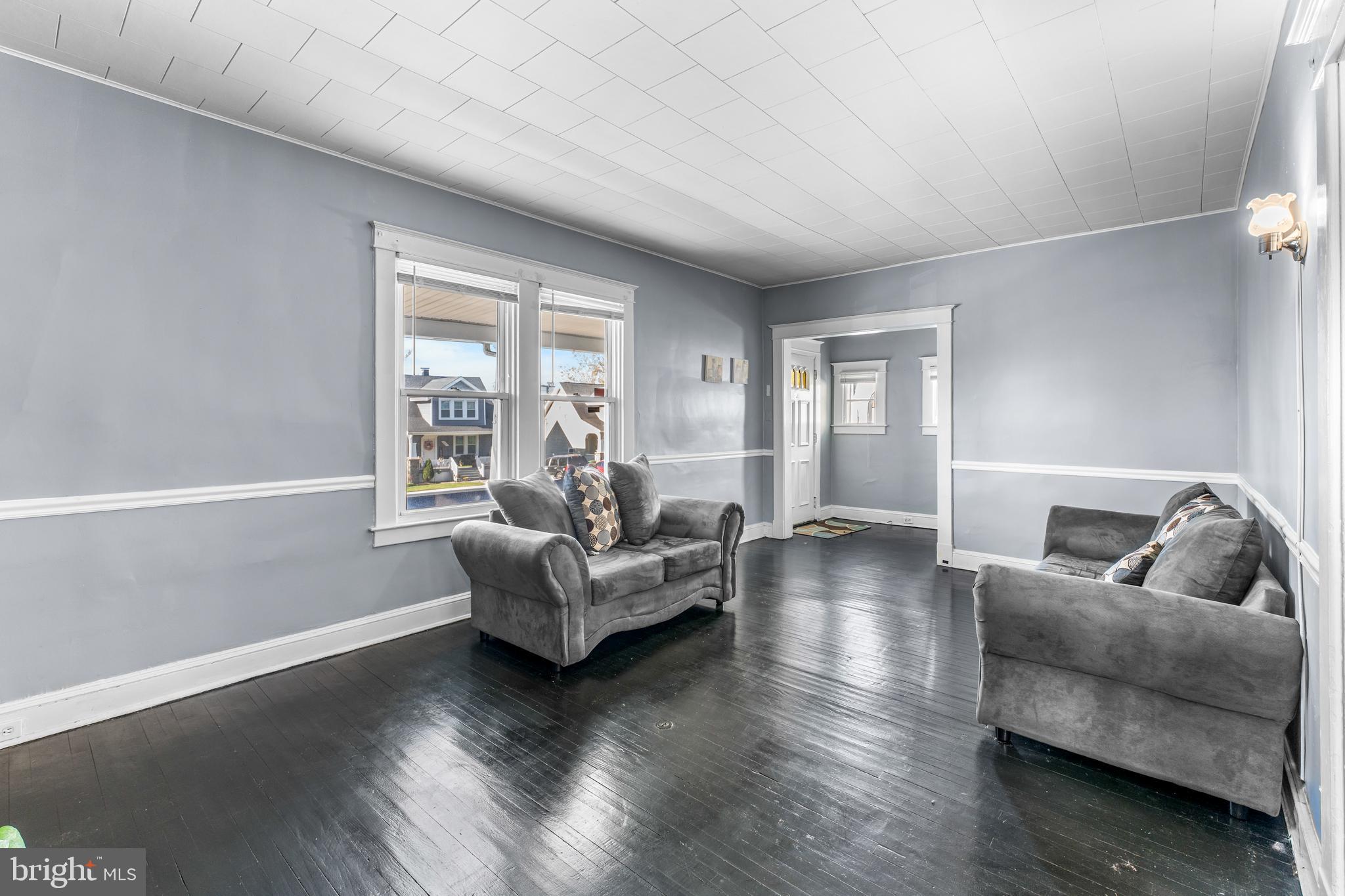 608 Tunbridge Road Baltimore, MD 21212 - Photo 5 of 27 a living room with furniture and a large window