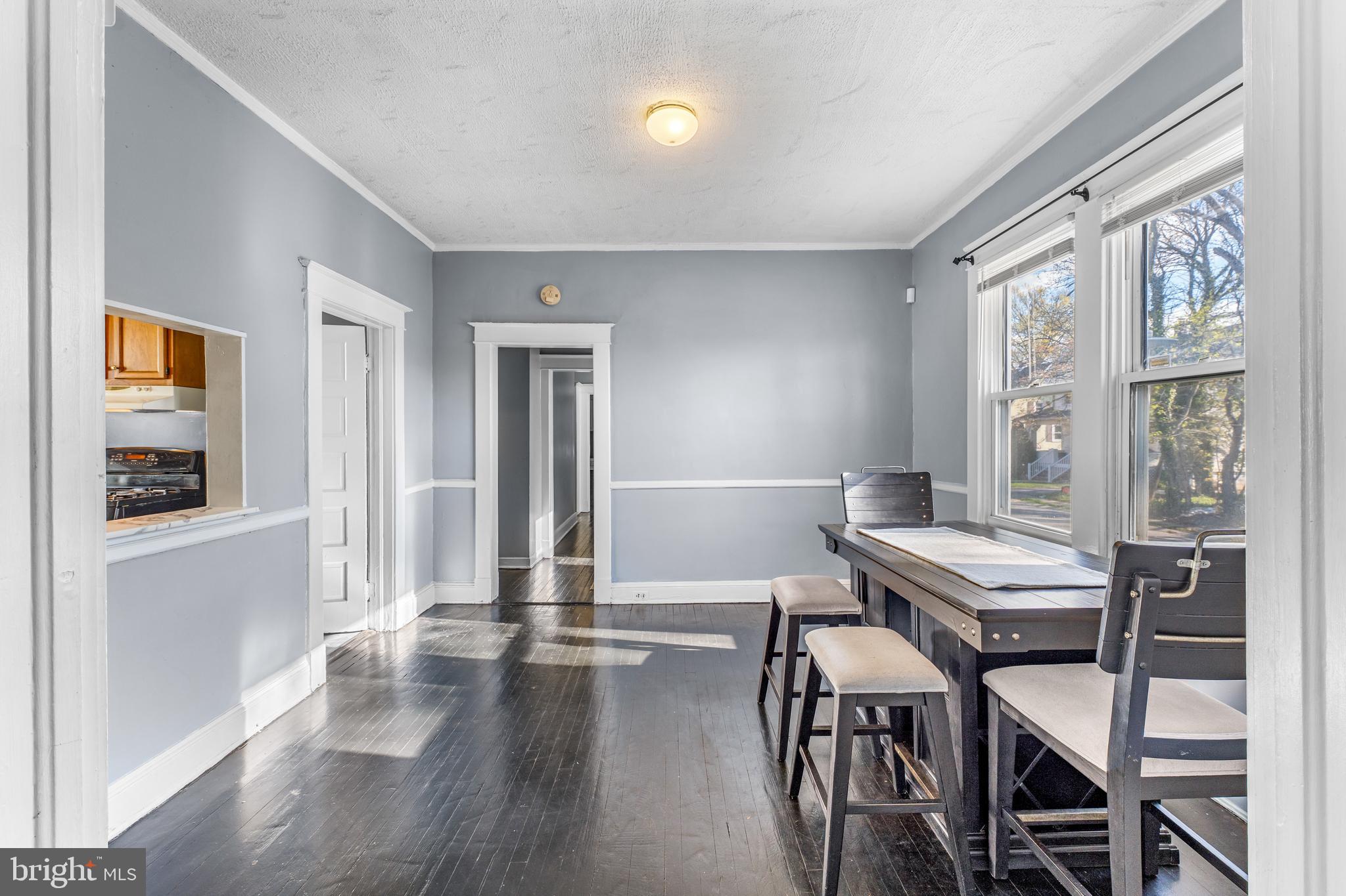 608 Tunbridge Road Baltimore, MD 21212 - Photo 8 of 27 a workspace with furniture window and wooden floor