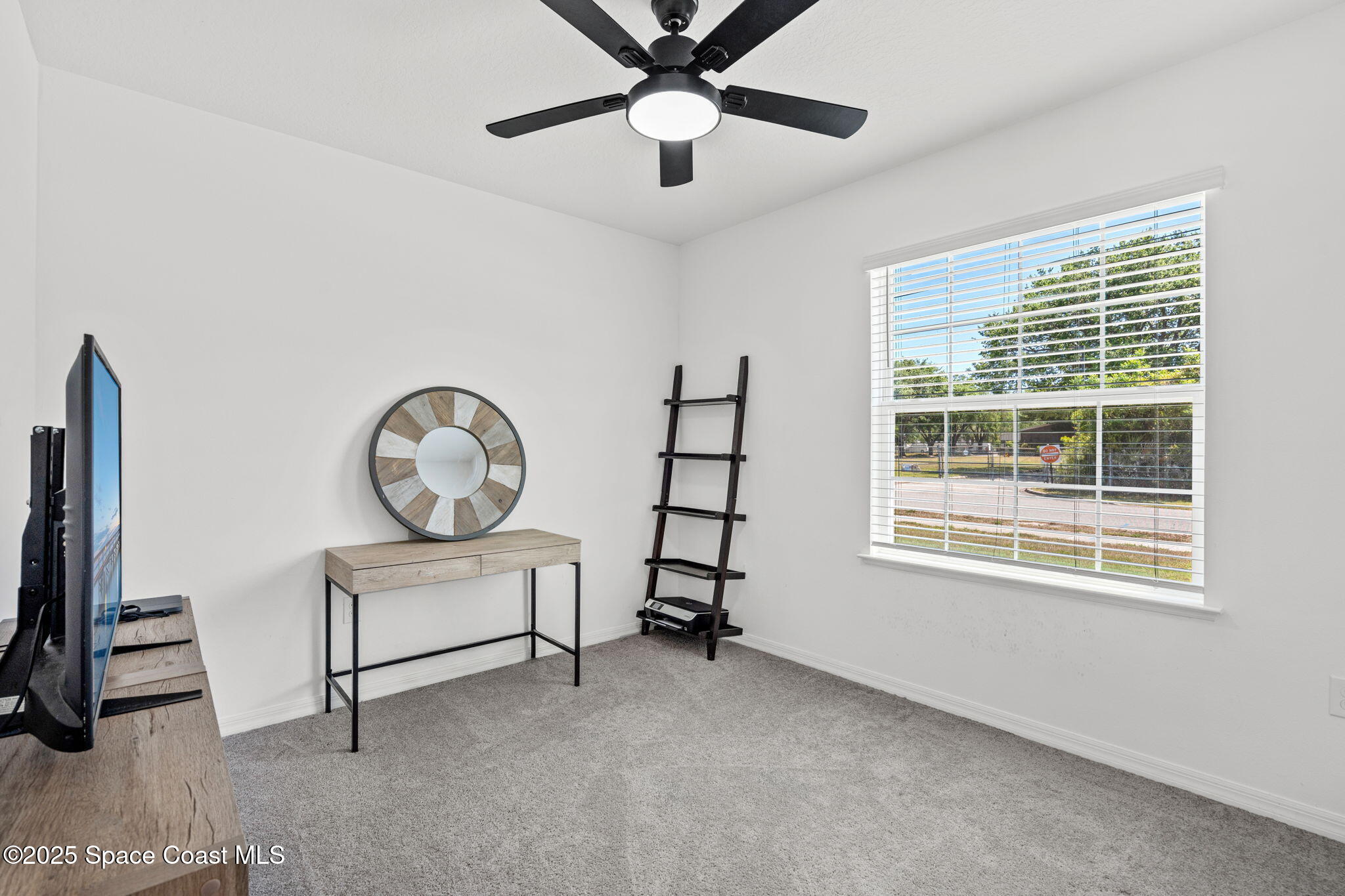 6162 Rena Avenue Cocoa, FL 32927 - Photo 20 of 42 a view of a livingroom with furniture and a window