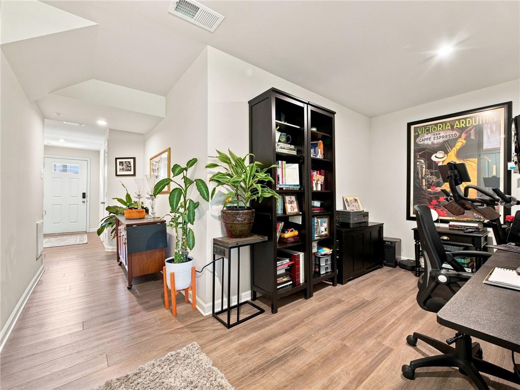 2133 Cross Country Road Northampton, PA 18067 - Photo 17 of 44 Smooth wood-style flooring runs continuously from the entry hallway into the versatile workspace.