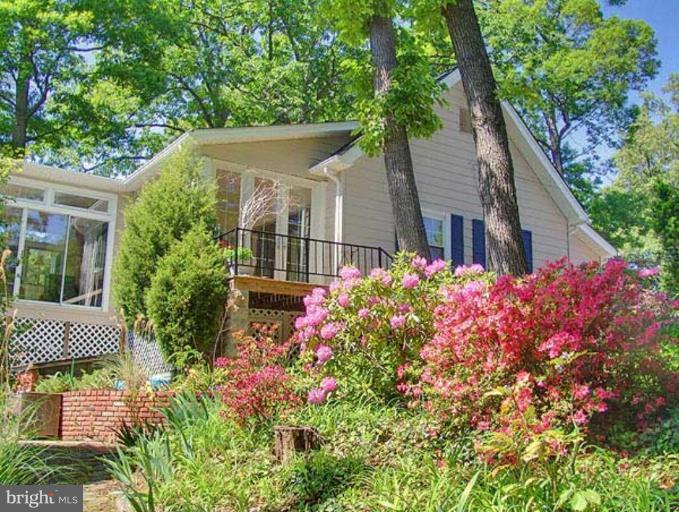 330 Riverside Road Edgewater, MD 21037 - Photo 13 of 26 front view of a house with a garden
