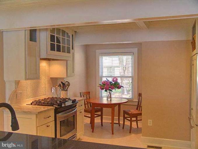 330 Riverside Road Edgewater, MD 21037 - Photo 14 of 26 a view of a dining room with furniture and chandelier
