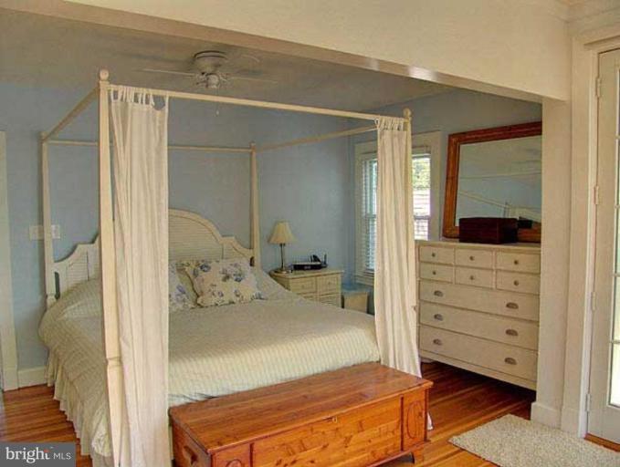 330 Riverside Road Edgewater, MD 21037 - Photo 16 of 26 a bedroom with a bed and a dresser
