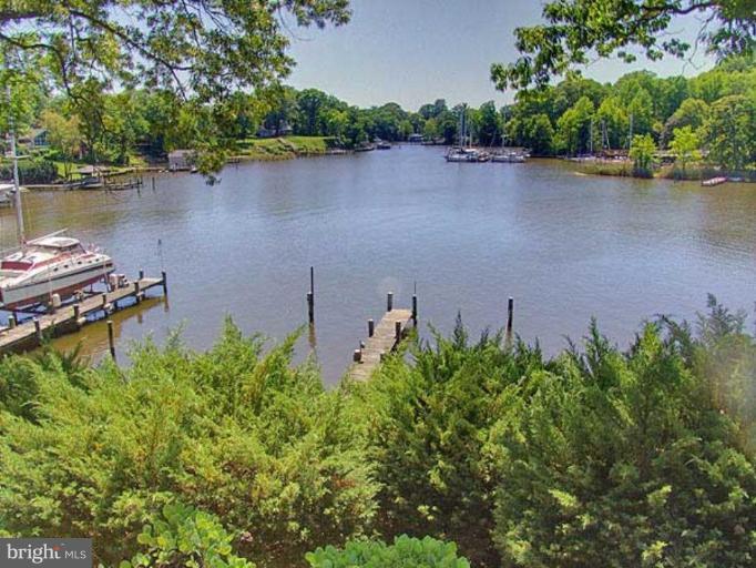 330 Riverside Road Edgewater, MD 21037 - Photo 19 of 26 an aerial view of a house with a yard and lake view