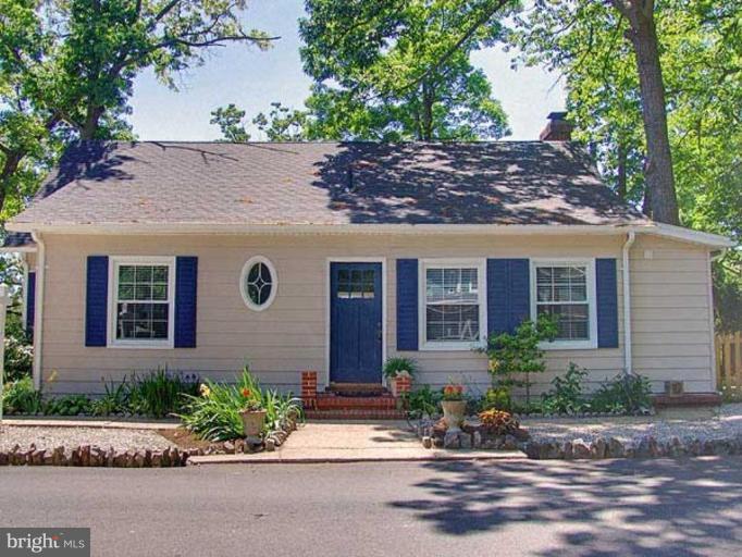 330 Riverside Road Edgewater, MD 21037 - Photo 6 of 26 front view of a brick house with a small yard