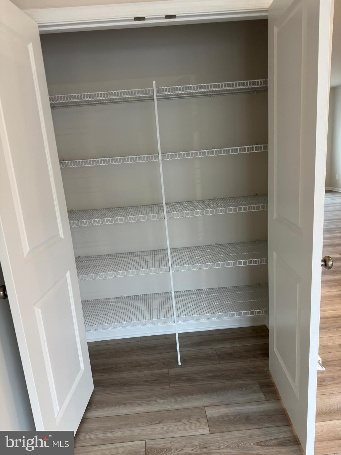 1260 Red Clover Lane Ranson, WV 25438 - Photo 13 of 20 a view of walk in closet with empty racks