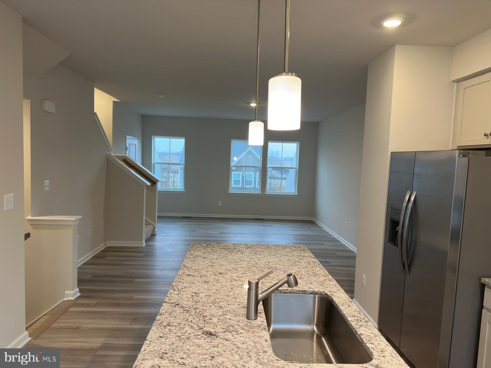 1260 Red Clover Lane Ranson, WV 25438 - Photo 6 of 20 a view of a kitchen center island and wooden floor