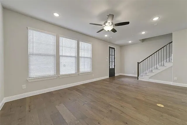 a view of a kitchen with a sink and a refrigerator
