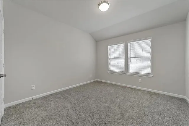 an empty room with closet area