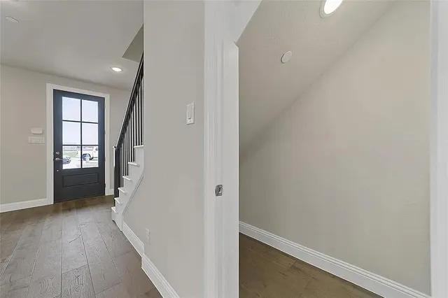 a kitchen with kitchen island white cabinets and stainless steel appliances