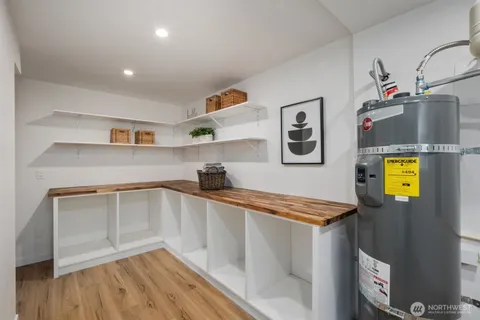 a kitchen with stainless steel appliances a refrigerator and a stove top oven
