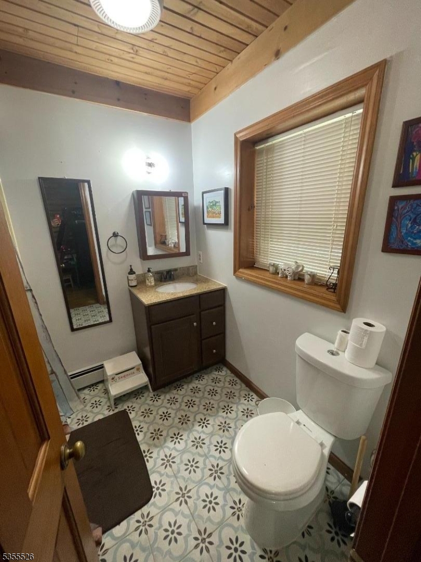 101 Flatbrook Road Branchville, NJ 07827 - Photo 16 of 28 a bathroom with a toilet sink and mirror