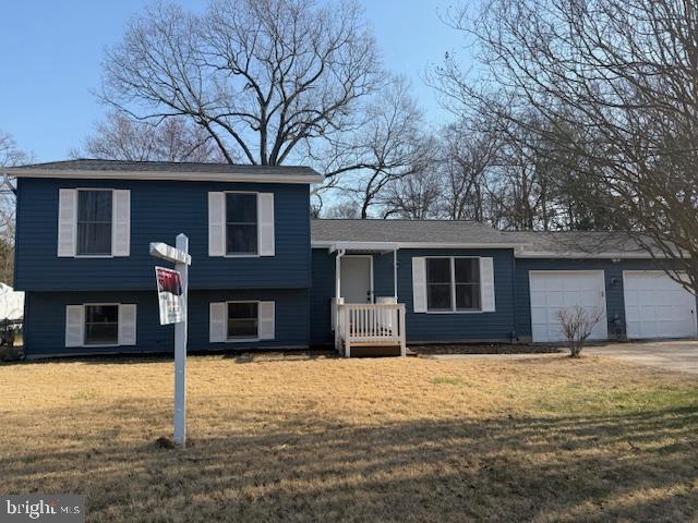 251 Ullman Road Pasadena, MD 21122 - Photo 1 of 29 a house that has a tree in front of the house