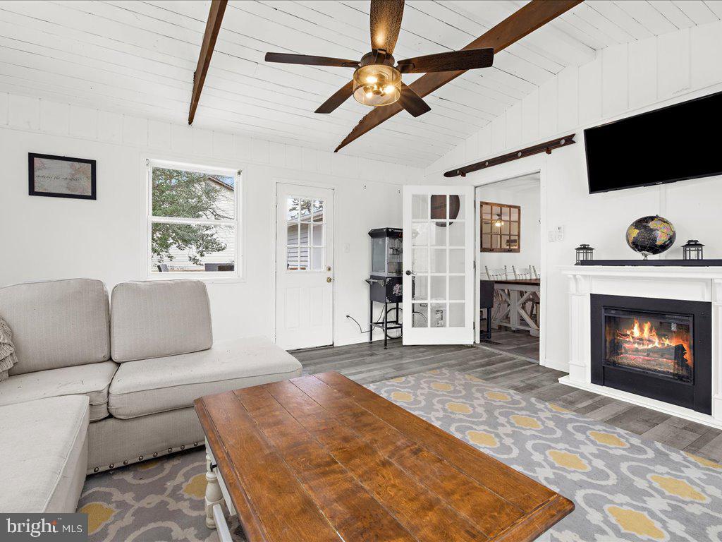 251 Ullman Road Pasadena, MD 21122 - Photo 11 of 29 a living room with furniture and a fireplace