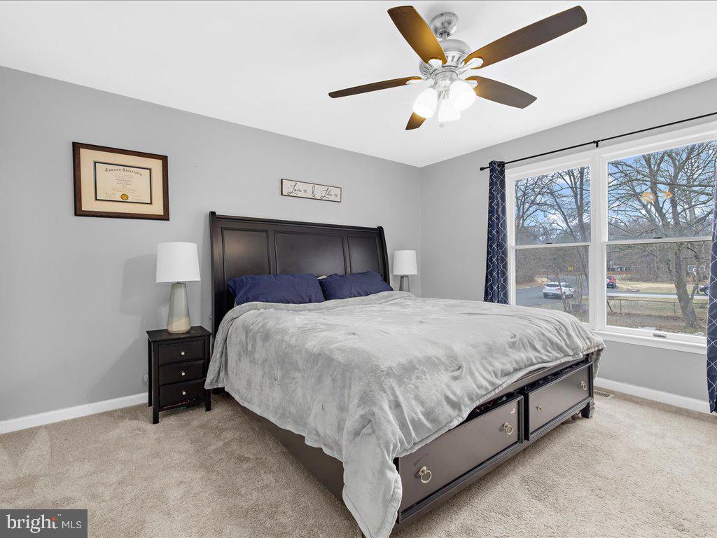251 Ullman Road Pasadena, MD 21122 - Photo 12 of 29 a bed sitting in a bedroom next to a window