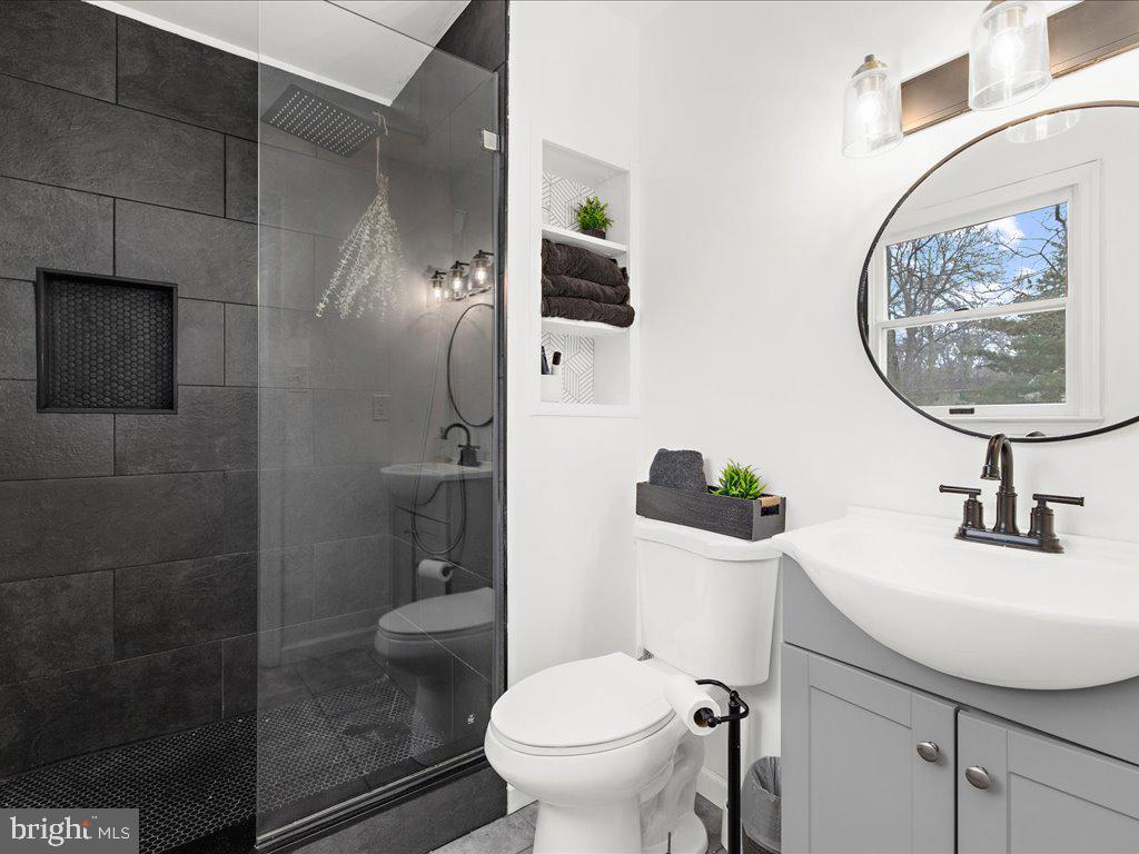 251 Ullman Road Pasadena, MD 21122 - Photo 13 of 29 a bathroom with a sink mirror and toilet