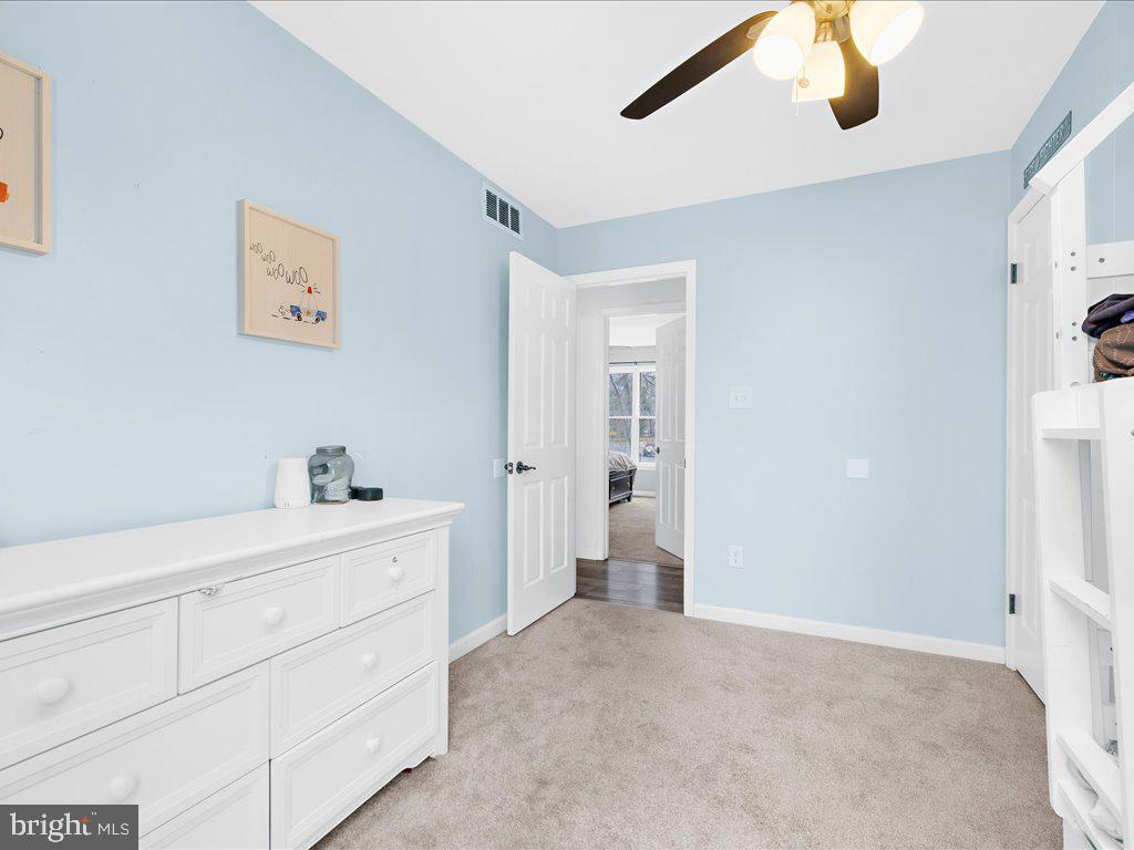 251 Ullman Road Pasadena, MD 21122 - Photo 15 of 29 a bedroom with a bed and a cabinets