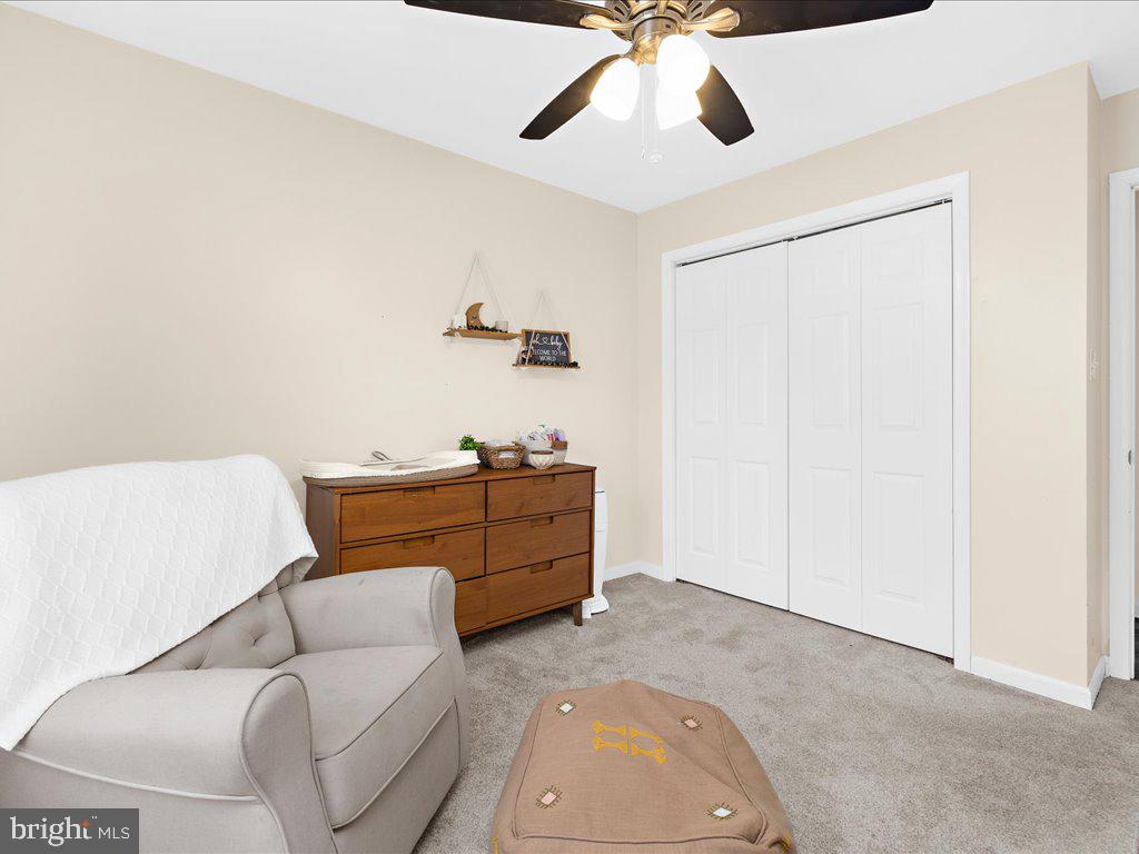 251 Ullman Road Pasadena, MD 21122 - Photo 16 of 29 a room with furniture and a ceiling fan