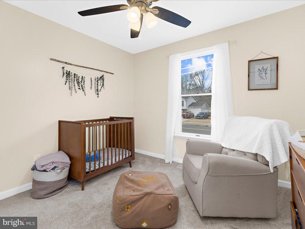 251 Ullman Road Pasadena, MD 21122 - Photo 17 of 29 a bedroom with furniture and a window