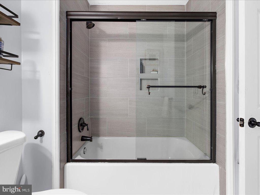 251 Ullman Road Pasadena, MD 21122 - Photo 19 of 29 a bathroom with a shower and a sink