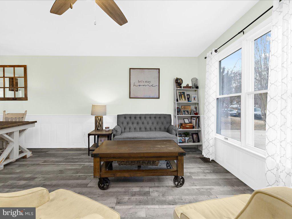 251 Ullman Road Pasadena, MD 21122 - Photo 4 of 29 a living room with furniture and a book shelf