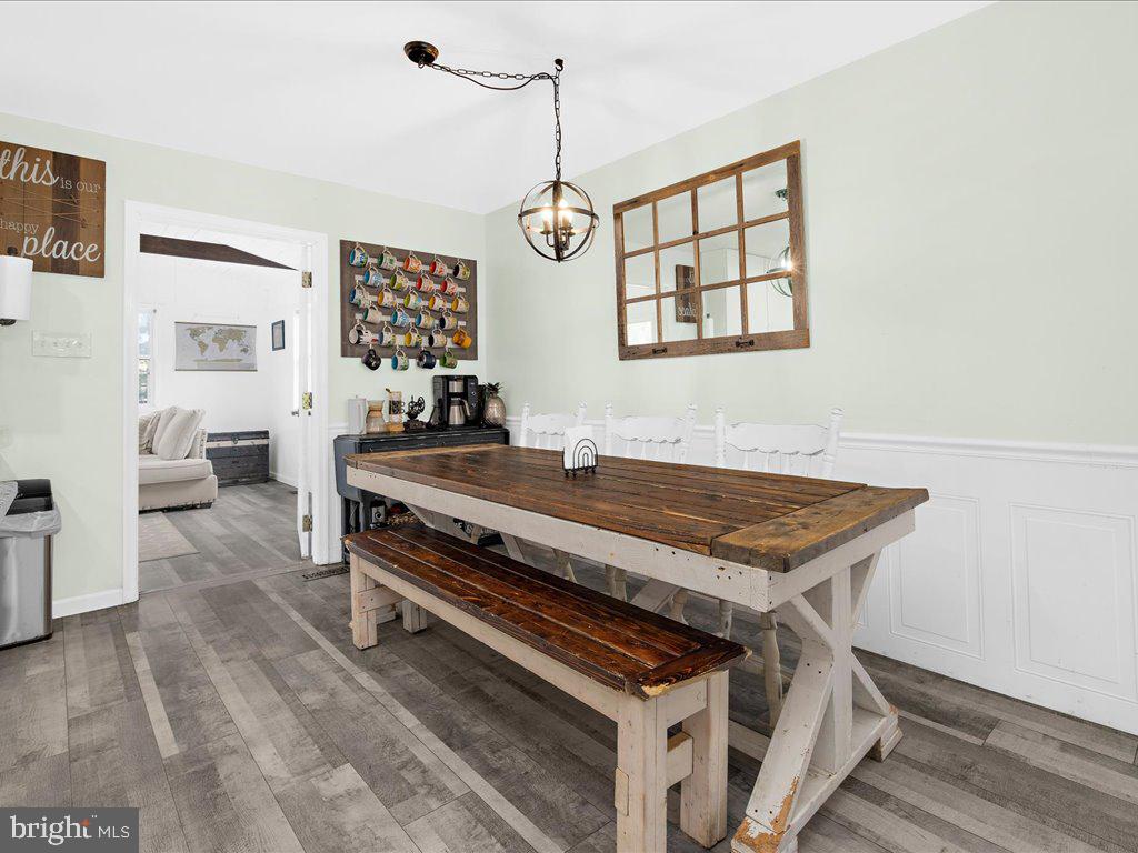 251 Ullman Road Pasadena, MD 21122 - Photo 9 of 29 a dining room with furniture and a window