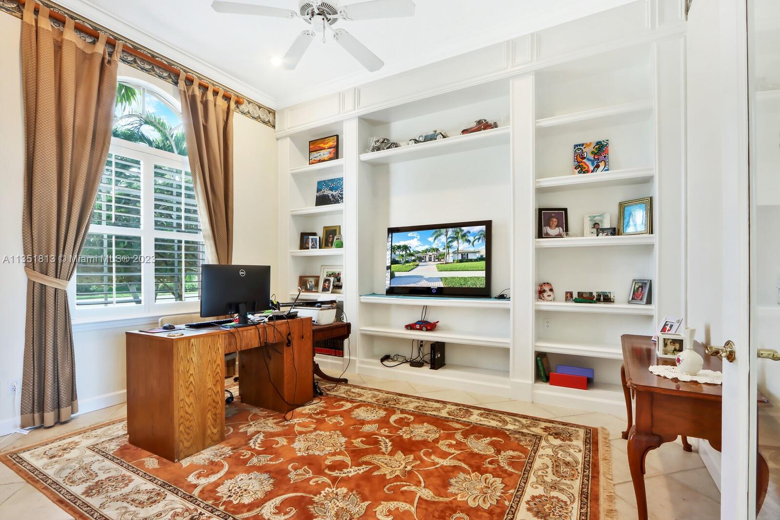 1237 Southwest Blue Stem Way Stuart, FL 34997 - Photo 12 of 48 a room with furniture and a flat screen tv