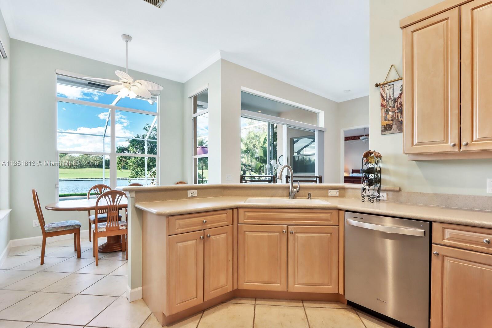 1237 Southwest Blue Stem Way Stuart, FL 34997 - Photo 15 of 48 a kitchen with stainless steel appliances granite countertop a sink and a cabinets