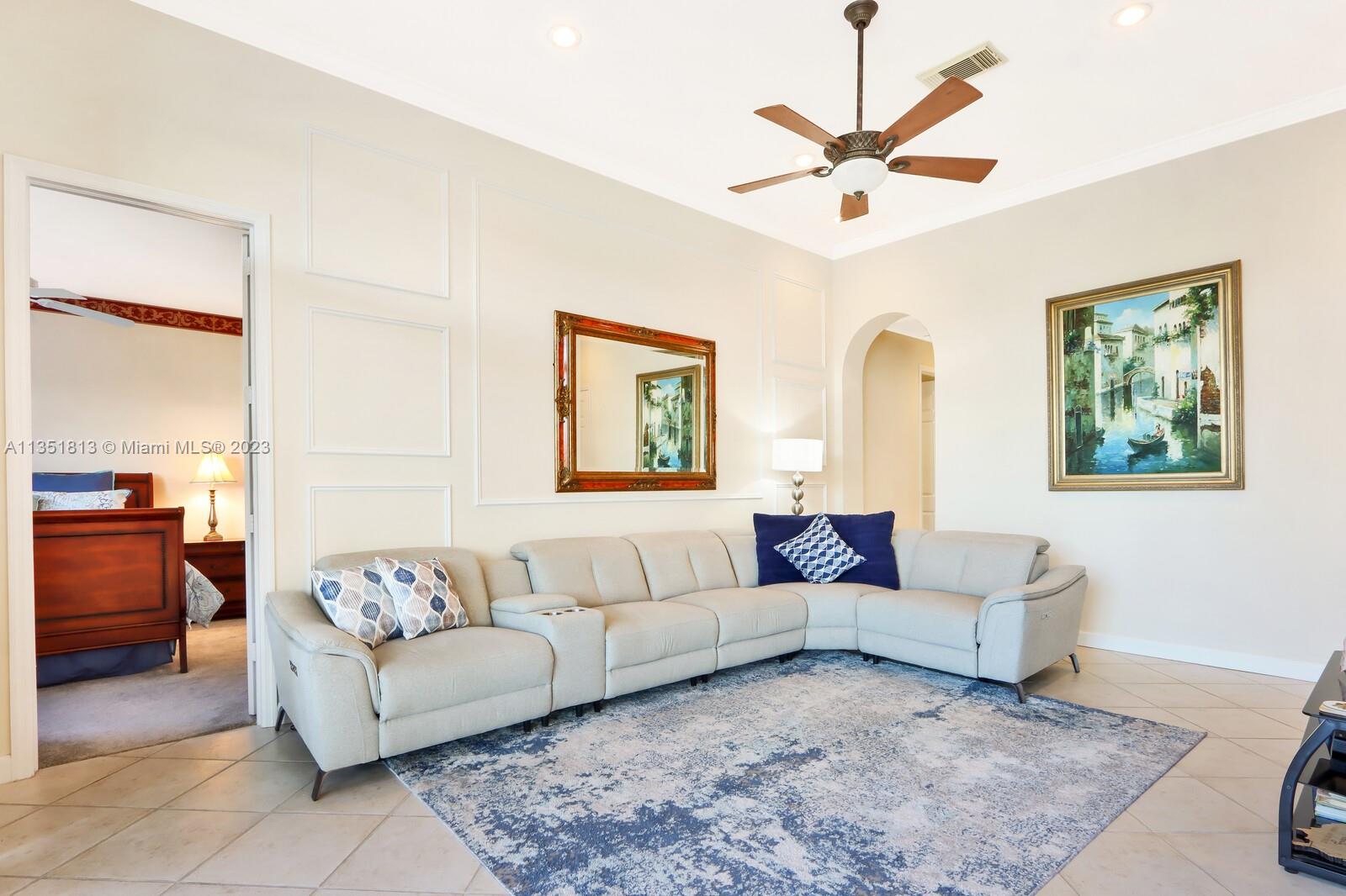 1237 Southwest Blue Stem Way Stuart, FL 34997 - Photo 20 of 48 a living room with furniture and a large window