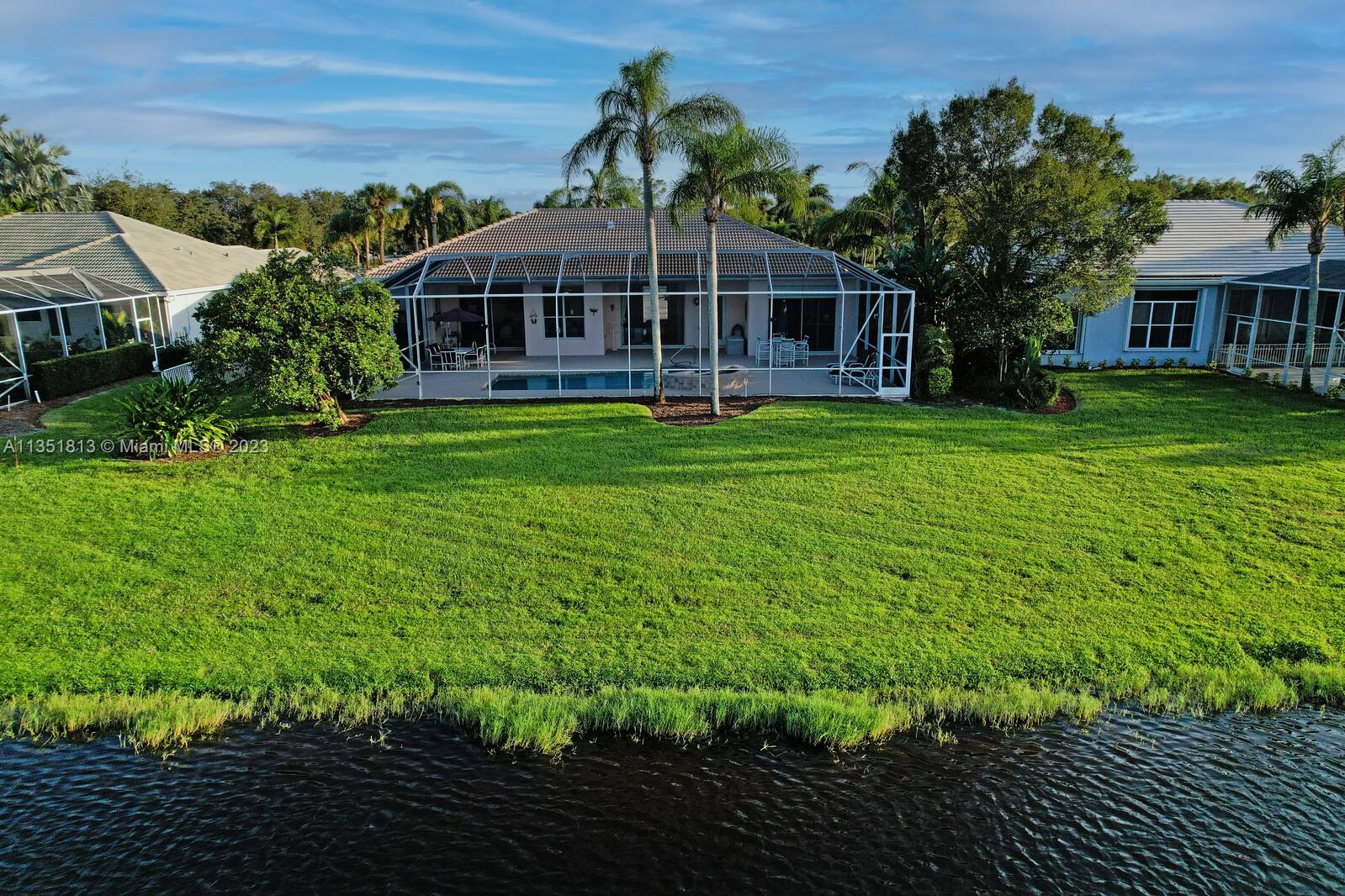1237 Southwest Blue Stem Way Stuart, FL 34997 - Photo 45 of 48 a view of a house with a backyard