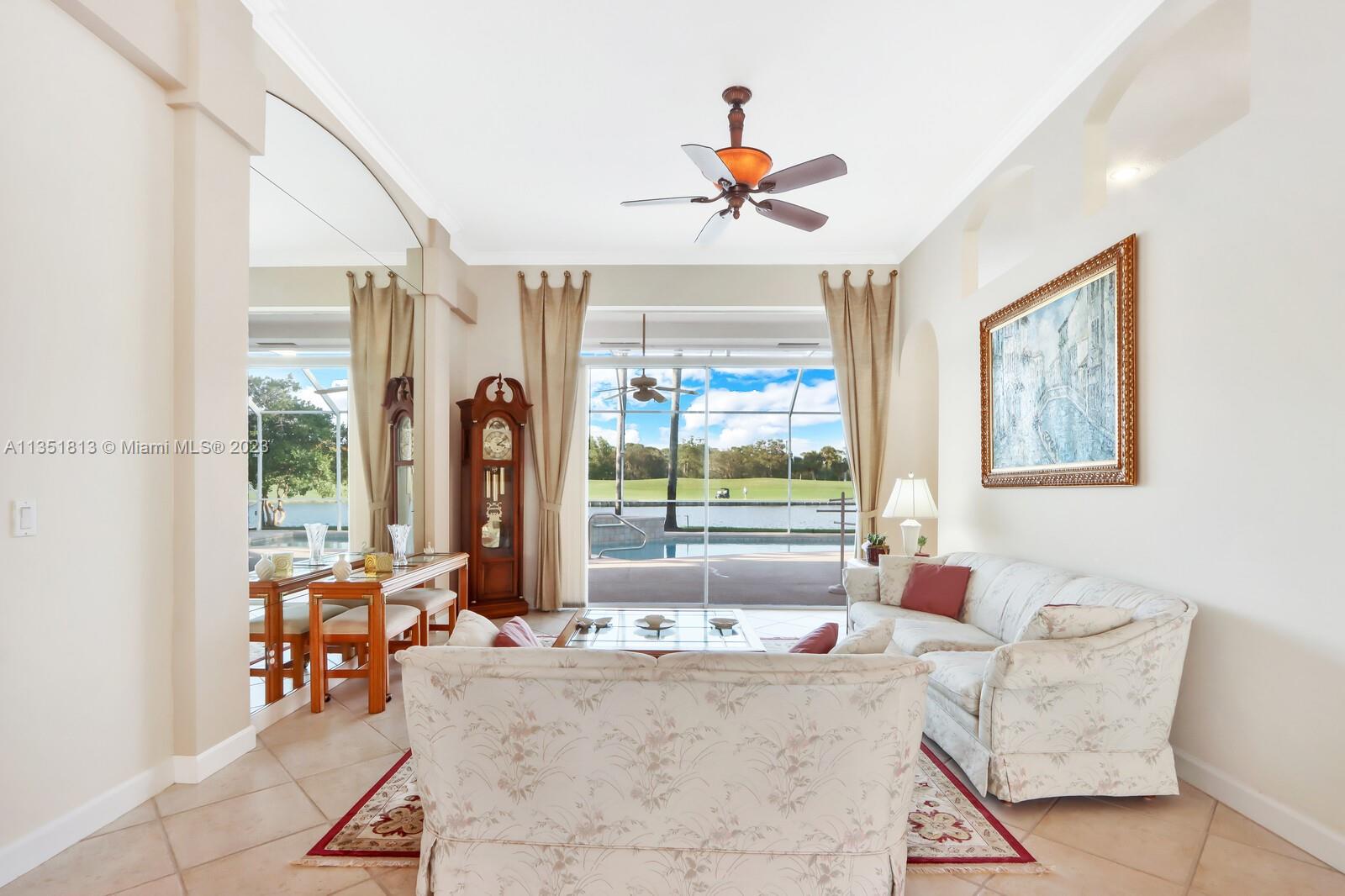 1237 Southwest Blue Stem Way Stuart, FL 34997 - Photo 7 of 48 a living room with furniture and a large window