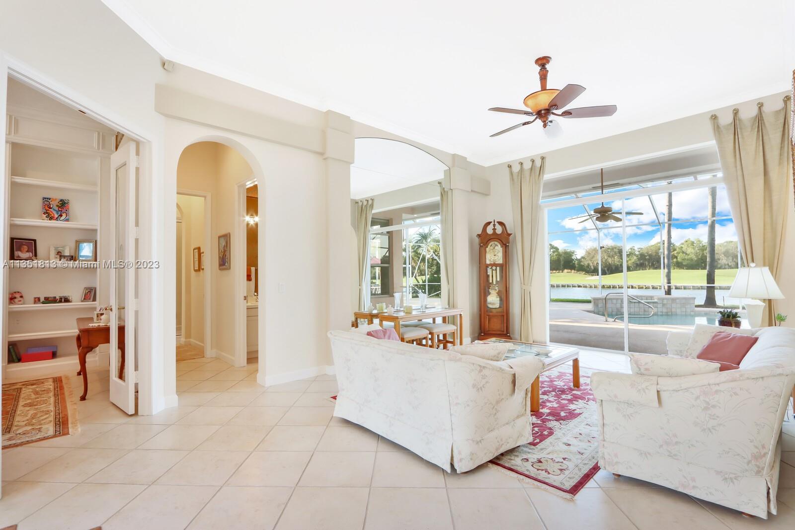 1237 Southwest Blue Stem Way Stuart, FL 34997 - Photo 8 of 48 a living room with furniture and a large window