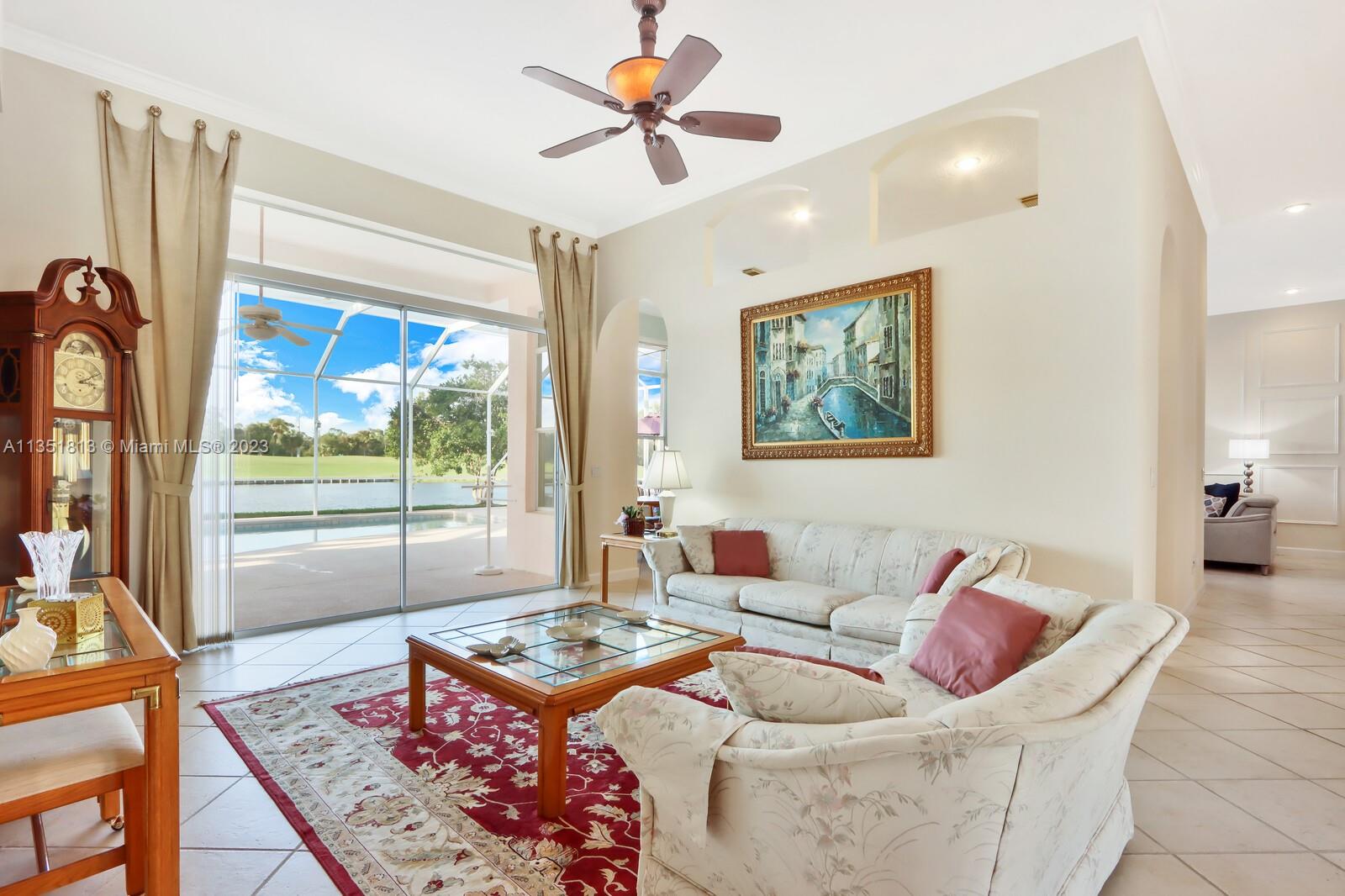 1237 Southwest Blue Stem Way Stuart, FL 34997 - Photo 9 of 48 a living room with furniture and a large window