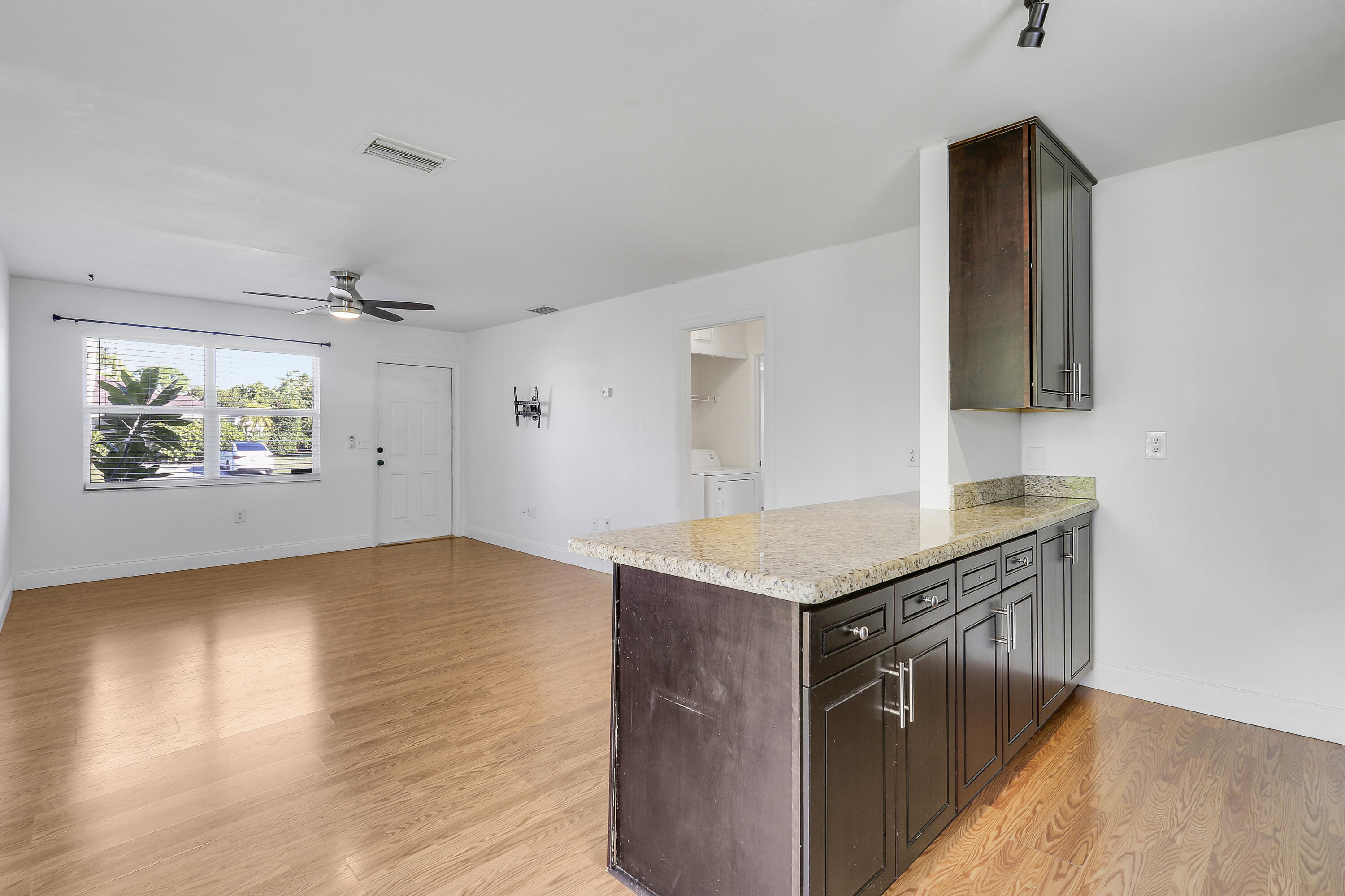 6264 Allen Street Jupiter, FL 33458 - Photo 12 of 27 a kitchen with stainless steel appliances granite countertop a granite counter tops and a stove