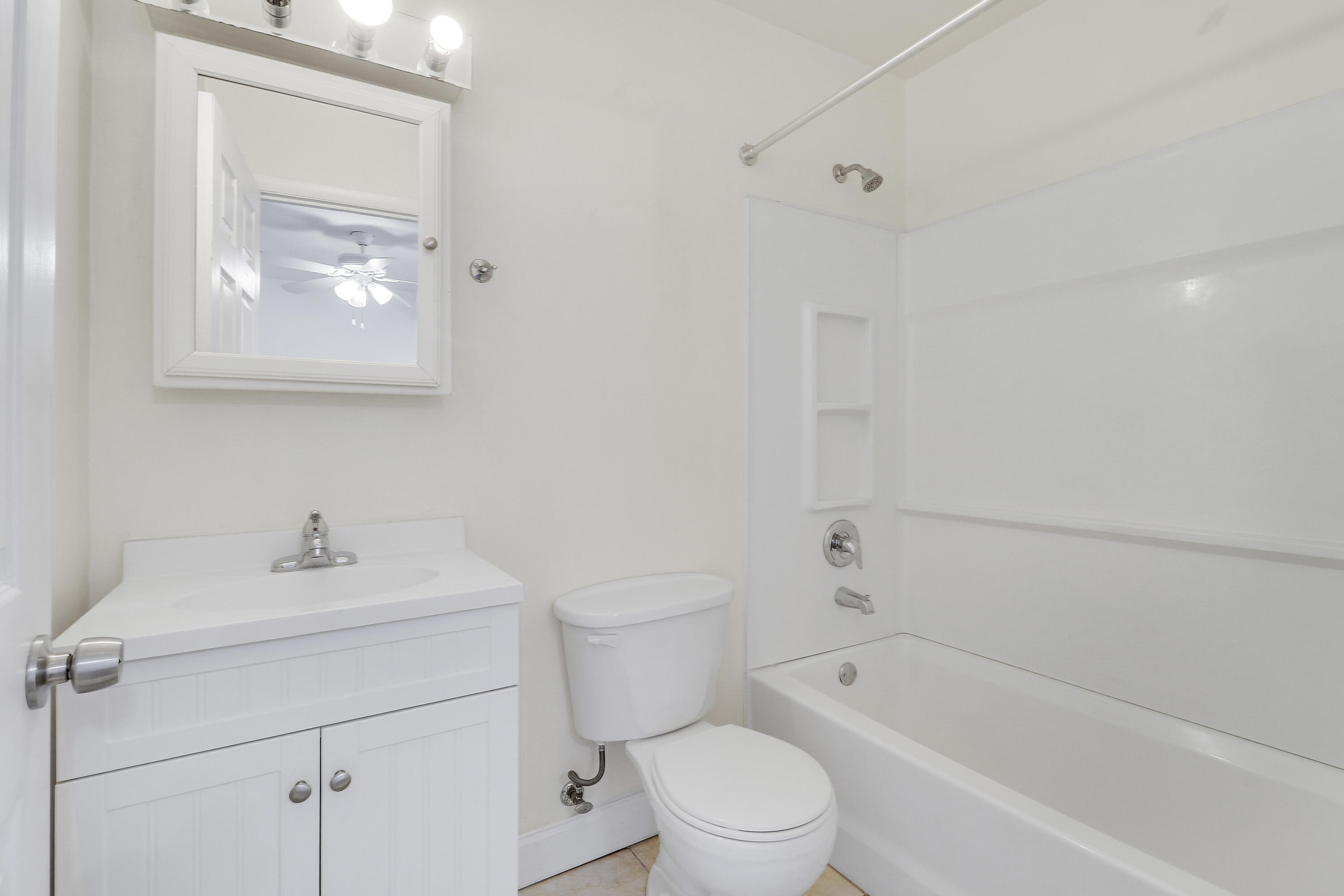 6264 Allen Street Jupiter, FL 33458 - Photo 19 of 27 a bathroom with a toilet sink and bathtub